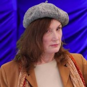 Serious brunette woman wearing a beret